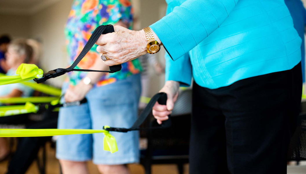 Showing hands and arms using stretching bands 